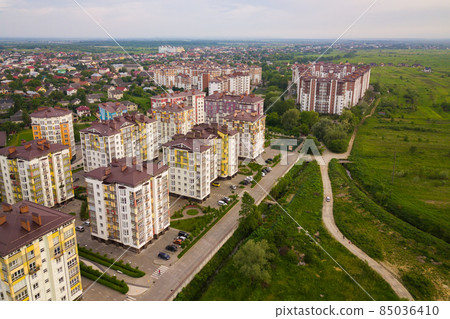 Aerial view of city residential area with high apartment buildings. Aerial view of city residential area with high apartment buildings. 85036410