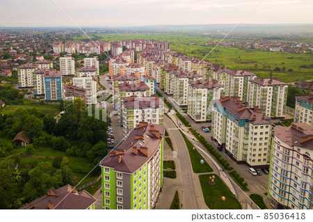 Aerial view of city residential area with high apartment buildings. Aerial view of city residential area with high apartment buildings. 85036418