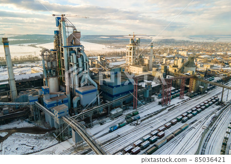 Aerial view of cement plant with high factory structure at industrial production area. Aerial view of cement plant with high factory structure at industrial production area. 85036421