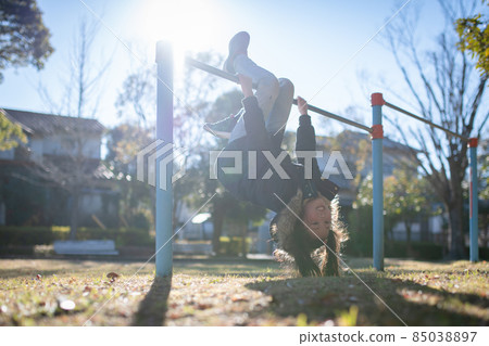 Child practicing upside-down 85038897