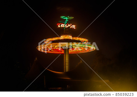 Kouvola, Finland - 28 August 2021: Rotating ride Taifun in amusement park Tykkimaki at night 85039223