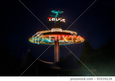 Kouvola, Finland - 28 August 2021: Rotating ride Taifun in amusement park Tykkimaki at night 85039226