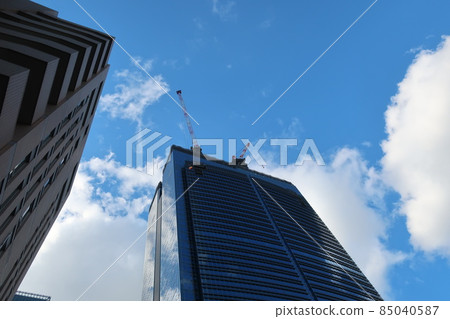 Construction of skyscrapers in the business district in the blue sky and white clouds Construction of skyscrapers in the business district in the blue sky and white clouds 85040587