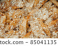 Close up of raw apple pie. Apple wedges sprinkled with nut crumbs 85041135