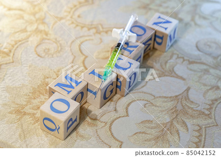 Omicron. Natural wood cubes with blue letters Omicron. Natural wood cubes with blue letters 85042152