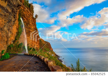 Waterfall on an old road near Ponta do Sol in Madeira Island, Portugal Waterfall on an old road near Ponta do Sol in Madeira Island, Portugal 85042525