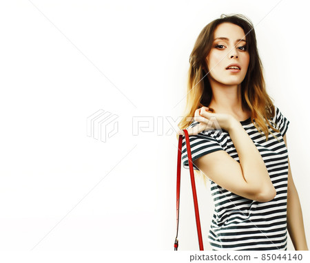young pretty teenage hipster girl posing emotional happy smiling on white background, lifestyle people concept 85044140