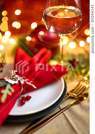 Traditional Christmas table place setting. Holidays background. Traditional Christmas table place setting. Holidays background. 85044141