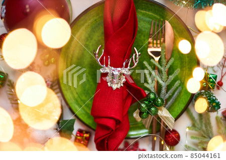 Traditional Christmas table place setting. Holidays background. Traditional Christmas table place setting. Holidays background. 85044161
