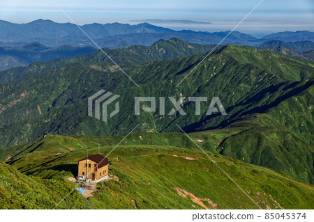 The eastern hut and the Sea of Japan, Awashima seen from the top of the Asahi mountain range and Mt. Itoh The eastern hut and the Sea of Japan, Awashima seen from the top of the Asahi mountain range and Mt. Itoh 85045374