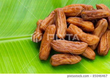 Sun-dried bananas on banana leaf Sun-dried bananas on banana leaf 85046467