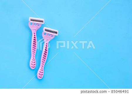 Women razors on blue background 85046491