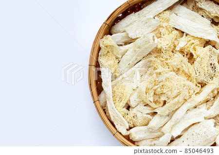 Dried tropical stinkhorn mushroom in bamboo basket 85046493