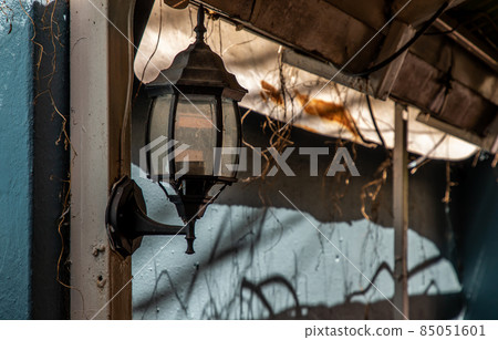 Street lamp on a steel pole at the blue brick wall. Street lamp on a steel pole at the blue brick wall. 85051601
