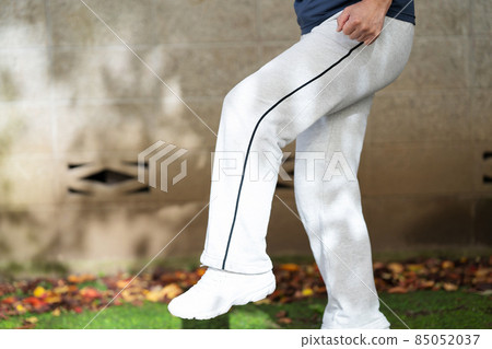 Senior men exercise foot raising 85052037