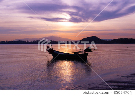 boat of fisherman on the beach with silhouette light before sunset and mountain background Asia Thailand 85054764
