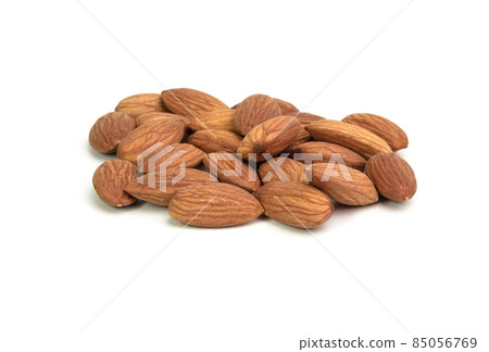 Handful almond isolated on a white background Handful almond isolated on a white background 85056769
