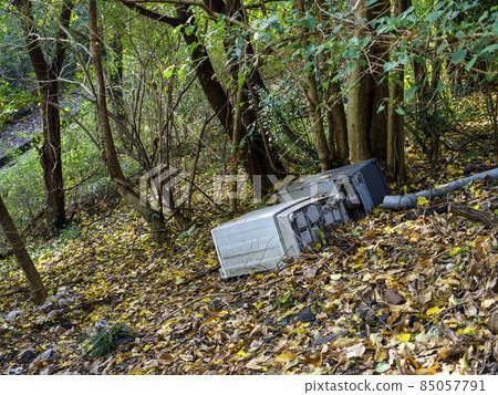 Oversized garbage illegally dumped in the forest 85057791