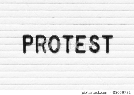 Black letter in word protest on white felt board background 85059781
