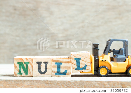 Toy forklift hold letter block l to complete word null on wood background Toy forklift hold letter block l to complete word null on wood background 85059782