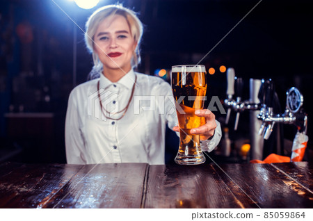 Portrait of girl bartending mixes a cocktail at the nightclub Portrait of girl bartending mixes a cocktail at the nightclub 85059864