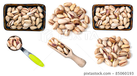 set of pistachio nuts cutout on white set of pistachio nuts cutout on white 85060193