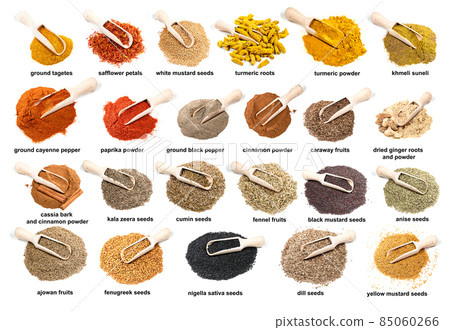set of wooden scoopes on piles of flavorings 85060266