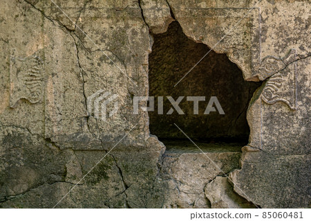 empty sarcophagus with a hole in the wall in the ruins of the antique city of Olympos, Turkey 85060481