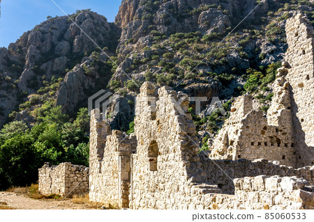 ruins of ancient buildings on the background of mountains in the antique city of Olympos, Turkey 85060533