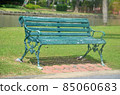 The chair is in the park.  85060683
