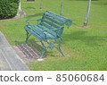 The chair is in the park.  85060684