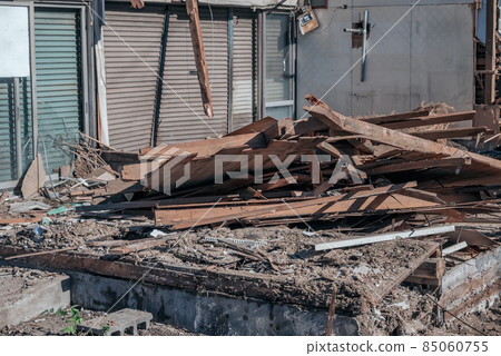 Demolition work on an aging wooden store 85060755