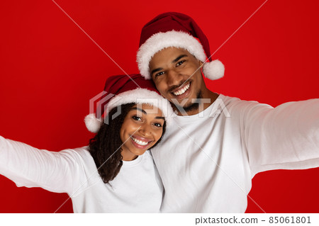 Cute african american loving couple taking selfie together 85061801