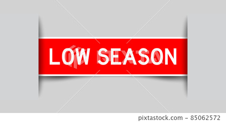 Inserted red color label sticker with word low season on gray background Inserted red color label sticker with word low season on gray background 85062572