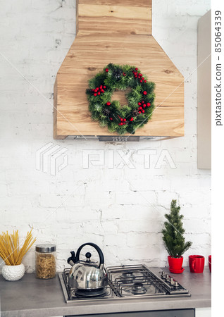 Kitchen decor for Christmas, New Year. Kitchen details, place for text. Kitchen decor for Christmas, New Year. Kitchen details, place for text. 85064339