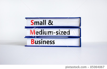 SMB small and medium-sized business symbol. Words SMB small and medium-sized business on books on a beautiful white background. Business and SMB small and medium-sized business concept. Copy space. 85064867