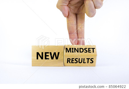 New mindset and results symbol. Businessman turns the wooden block and changes words 'new mindset' to 'new results'. Beautiful white background. Business, new mindset and results concept. Copy space. 85064922