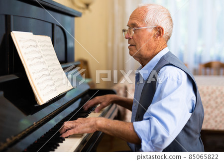 Compositor creating new music with piano at home Compositor creating new music with piano at home 85065822