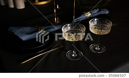 Two popular vintage champagne glasses on a dark background of the served table 85066507