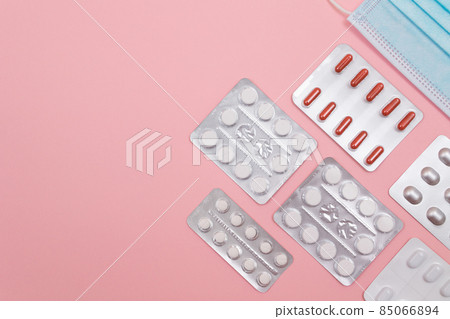 Different Pills and Tablets Package on Pink Background Different Pills and Tablets Package on Pink Background 85066894
