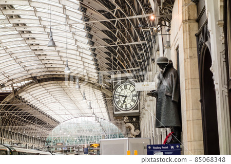 A statue of a soldier on the platform of a steel and glass station building at Paddington Station in London A statue of a soldier on the platform of a steel and glass station building at Paddington Station in London 85068348
