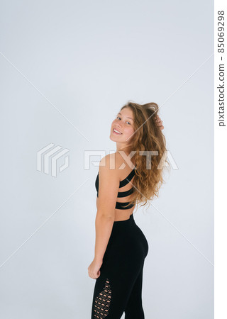 An ordinary young woman on a white background. Bodypositive concept. An ordinary young woman on a white background. Bodypositive concept. 85069298