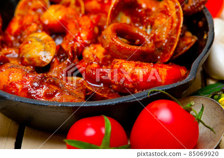 fresh seafoos stew on an iron skillet 85069920