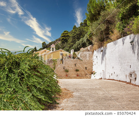 Monastery Mirtiotissas on the western Corfu island coast, Greece. Monastery Mirtiotissas on the western Corfu island coast, Greece. 85070424
