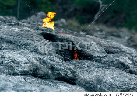 constantly burning fire at the place of a natural gas emission on Mount Chimaera (Yanartas), Turkey constantly burning fire at the place of a natural gas emission on Mount Chimaera (Yanartas), Turkey 85070475