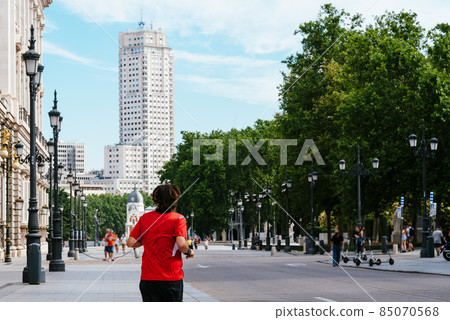 Woman runner doing sport in the historic center of Madrid, Spain Woman runner doing sport in the historic center of Madrid, Spain 85070568
