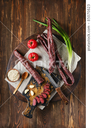 Overhead view of dried  sausage made of venison spicy meat 85070823