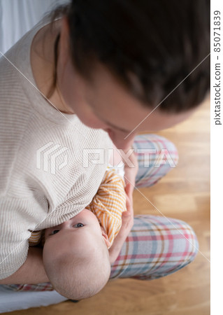 Funny caucasian baby lying on the bed. 85071839