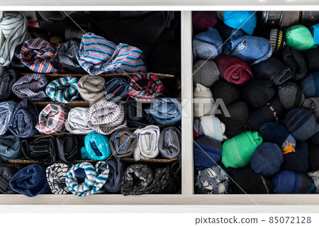 Home drawer box with organized folded underwear lingerie KonMari marie kondo vertical storage method. Sorted many different undergarments pants and socks at bedroom dresser Home drawer box with organized folded underwear lingerie KonMari marie kondo vertical storage method. Sorted many different undergarments pants and socks at bedroom dresser 85072128