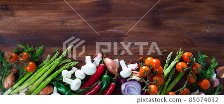 Mushrooms, vegetables, herbs on wooden surface Mushrooms, vegetables, herbs on wooden surface 85074032